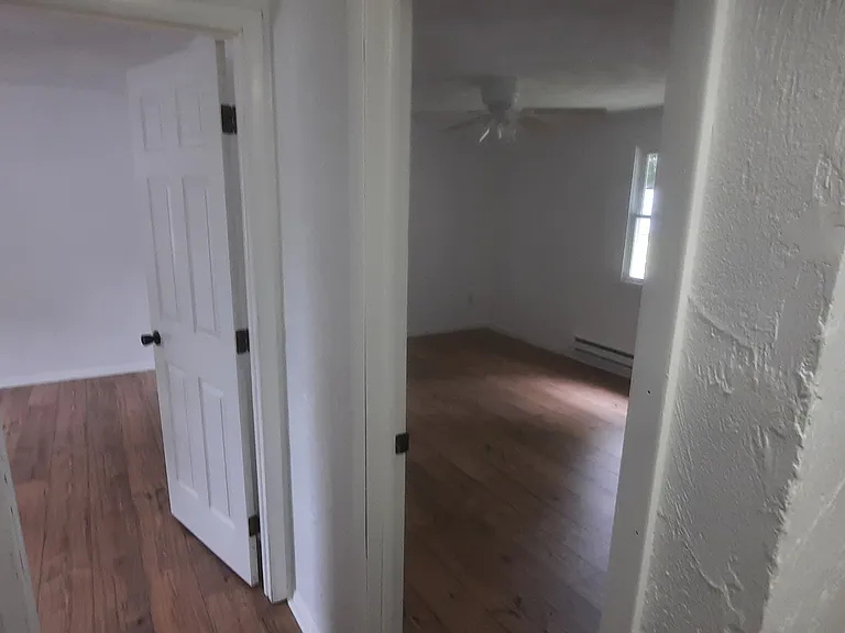 view from bathroom upstairs into the two bedrooms