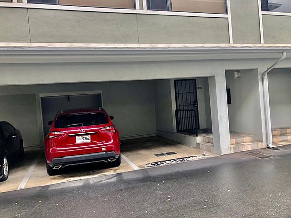 Corner unit with 2 covered parking stalls next to front door!