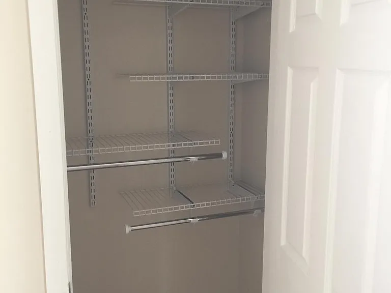 Closet organizers in the bedroom closets