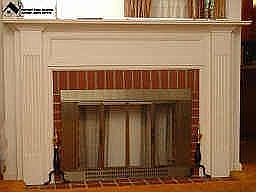 Decorative fireplace and mantle with large mirror 