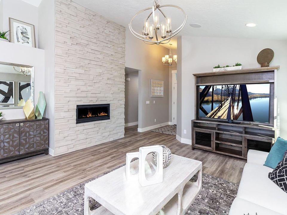 Representative Photo - Gather with family and friends in this cozy great room with fireplace