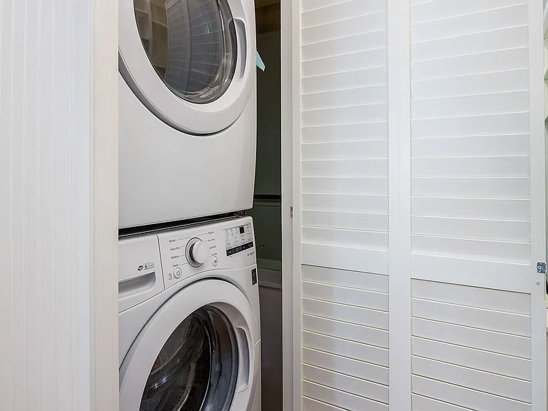 Apartment No. 6 full-size stacking washer and dryer.