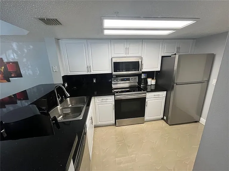 5051 Wiles Rd #207 — Photo 6