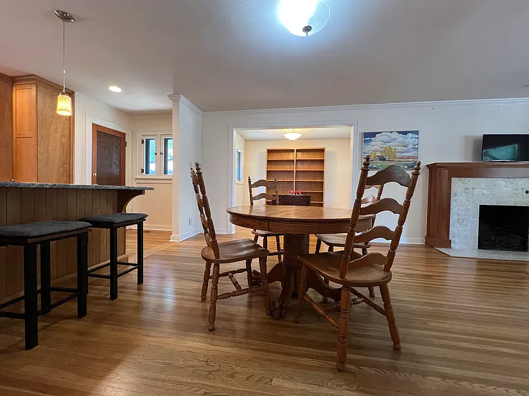 Another view of alternative layout with dining table near counter