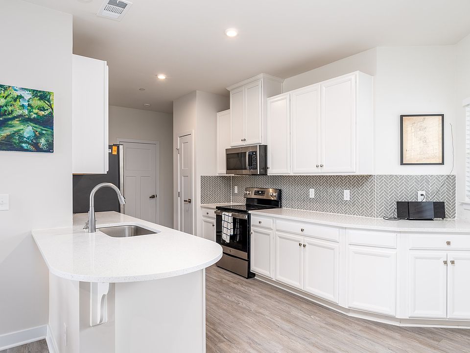 Fully equipped kitchen with modern applications and plenty of storage.