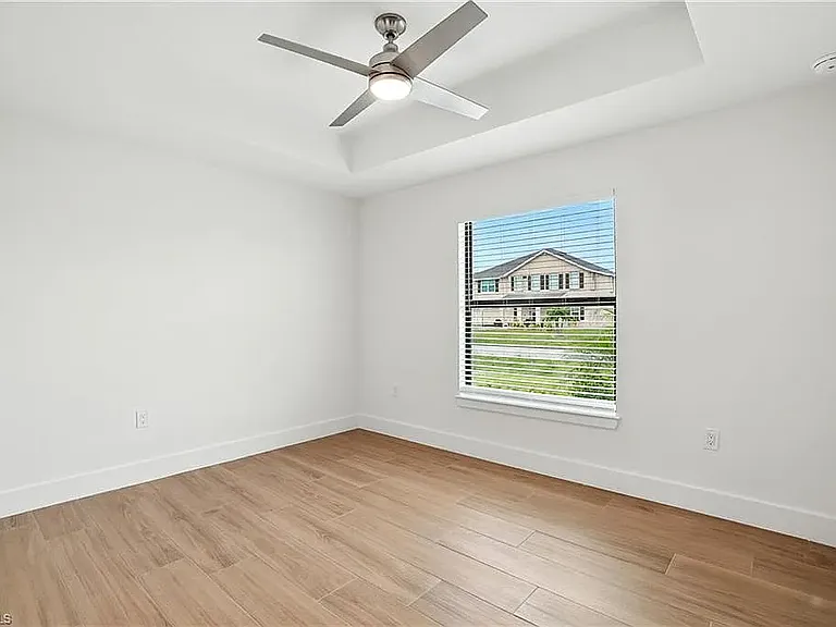 Coffered ceilings and ceiling fans in bedrooms.