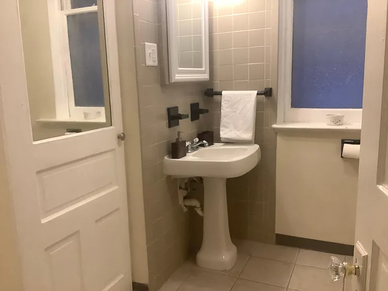 Bathroom with sink and linen closet