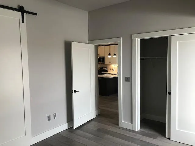 Master bedroom looking into kitchen