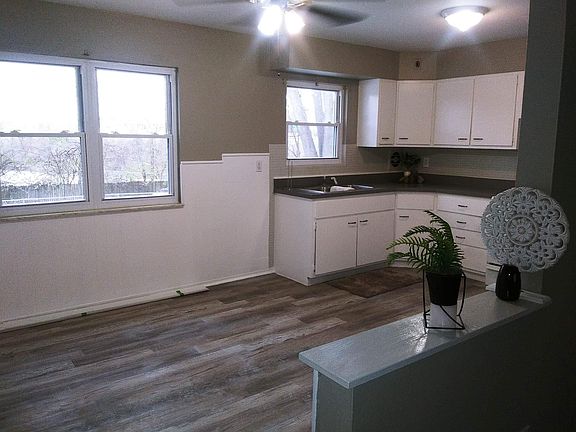Large eat-in kitchen with refrigerator and oven stove large pantry.
