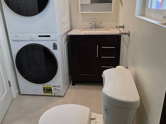 Bathroom with washer and dryer