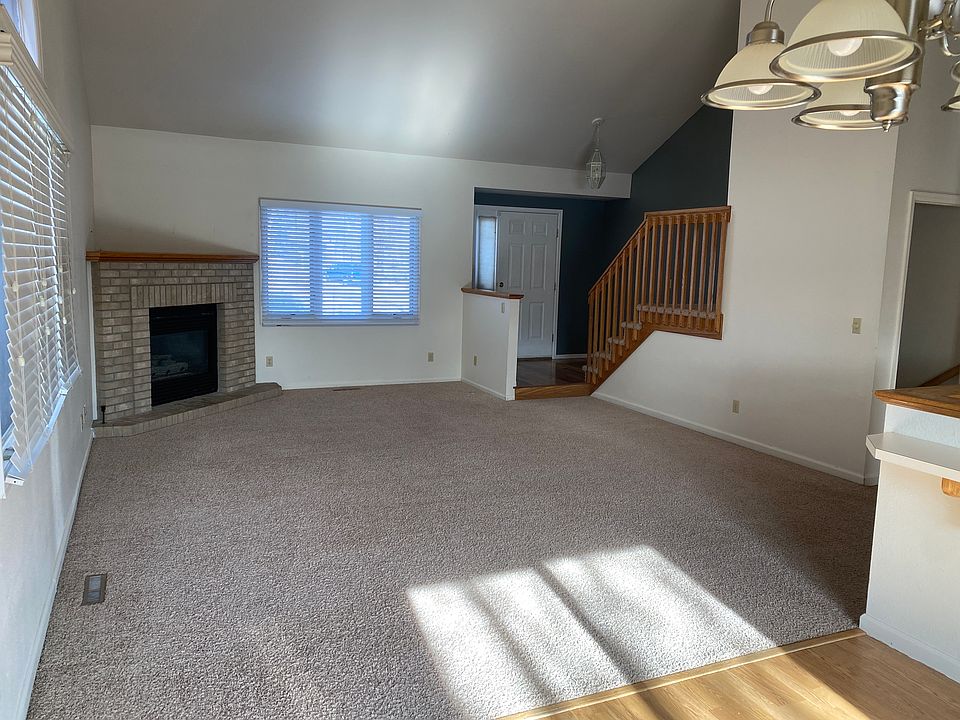 main floor living room, stairs to 2nd floor, front door.