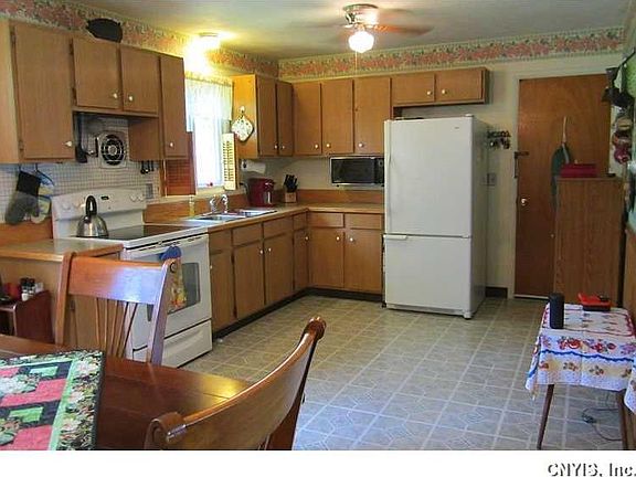 Kitchen. Huge Country Kitchen with brand new vinyl flooring, newer countertops & sink, and potential galore for an island or even more cabinetry!