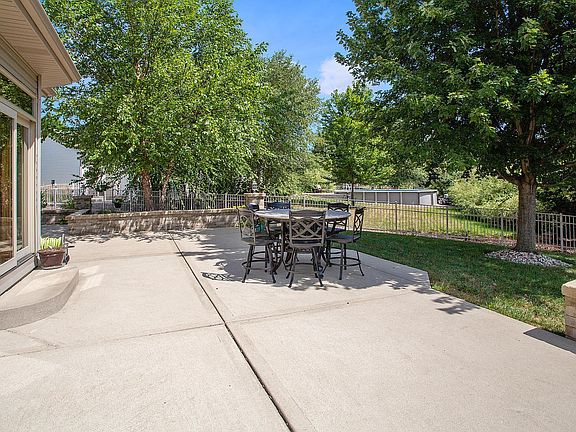 Just steps from your kitchen and one easy step down, your grand patio awaits you!