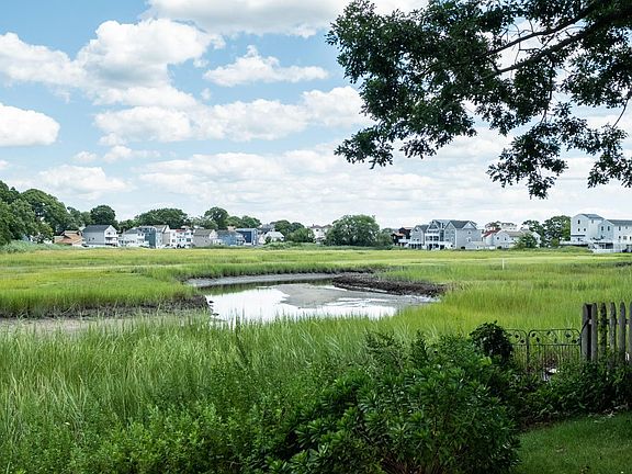 Directly overlooking a creek - launch a kayak from your backyard!