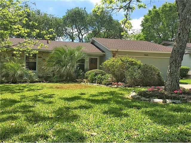 Lovely curb appeal! Landscaping includes roses, palms and rosemary