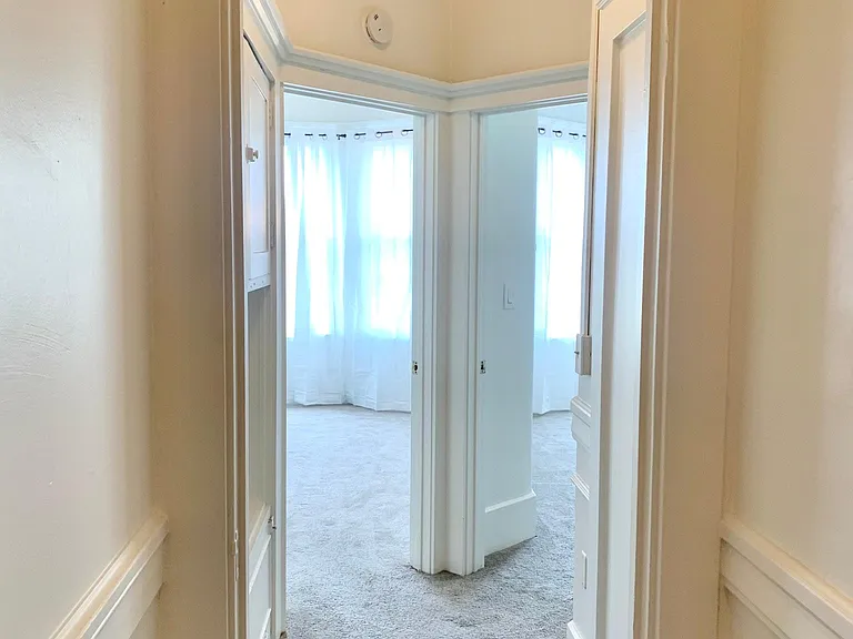 Hallway to back bedrooms