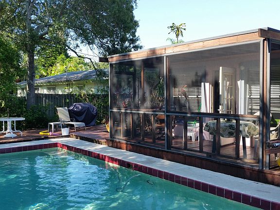 backyard pool, deck and screened-in porch