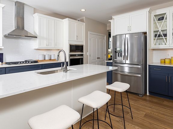 Island kitchen and adjoining breakfast area at a DRB Homes Clemson model at the Huntfield community.