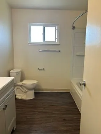 Main bath with new vanity, shower & tub, and linen closet