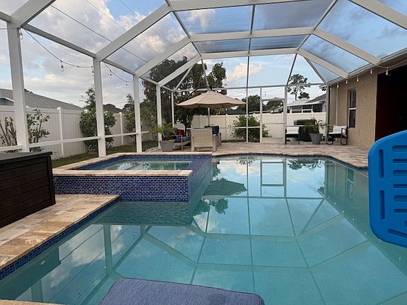 Resort-style screened pool and spa with a spacious patio_your private backyard oasis