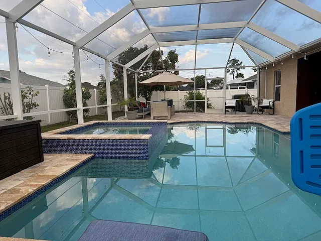 Resort-style screened pool and spa with a spacious patio_your private backyard oasis