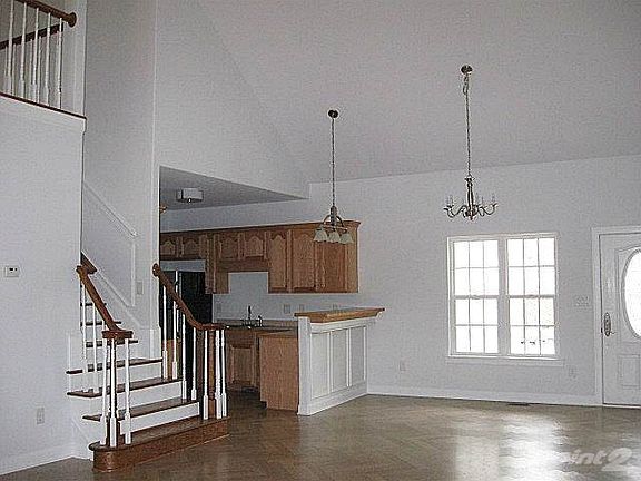 Breakfast bar adjoins dining area, which can accommodate a large table
