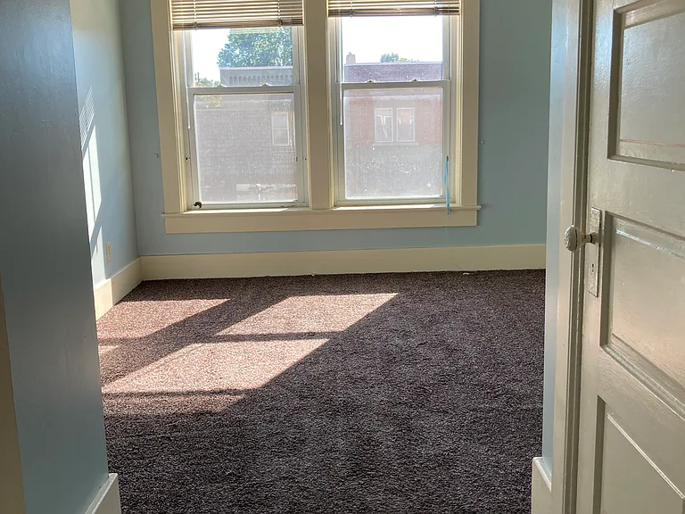 View from the hallway looking into bedroom 2