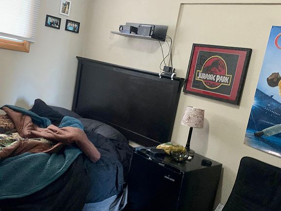 Bedroom #1 behind upstairs living room, sliding door to patio area