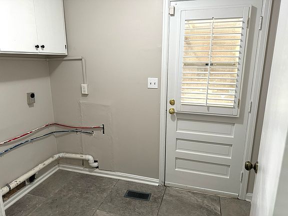Laundry room and entrance from attached garage