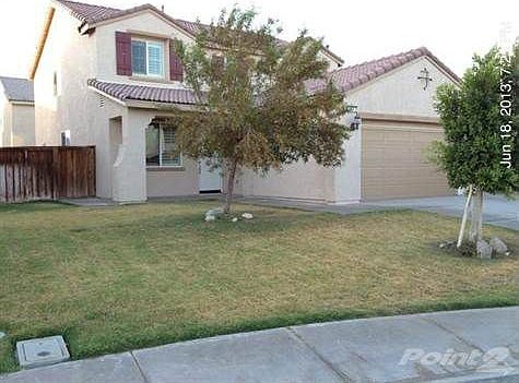 Fresh Paint on exterior, garage door, trim, and man doors...