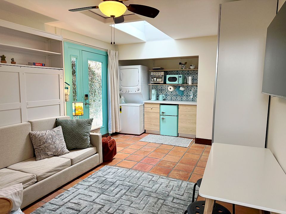 Skylight, sofa that folds into a queen bed, washer/dryer, kitchen