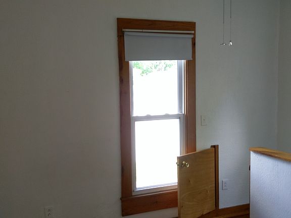 Window in smallest bedroom (or den). Short door leads ti fi