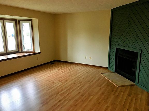 Livingroom with new flooring and fireplace