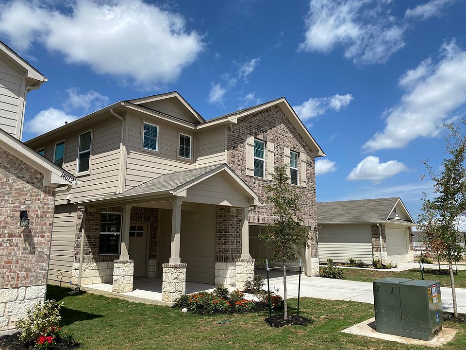 Charming front porch to welcome you home. Above the garage is the game room.