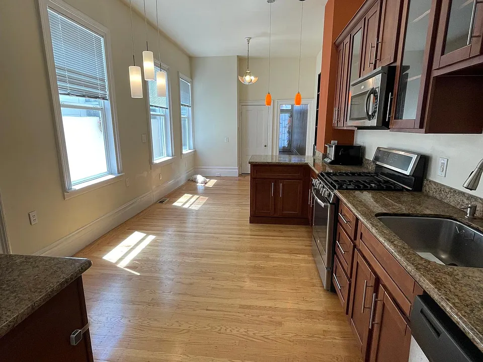 overall look at living room, kitchen, dining room