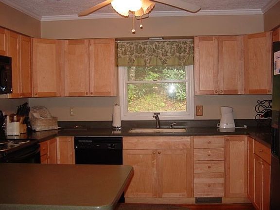 The large kitchen has ample cabinet storage and cabinet space.