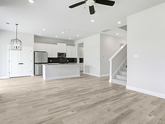 Spacious living area, connected to a breakfast nook and upgraded kitchen.