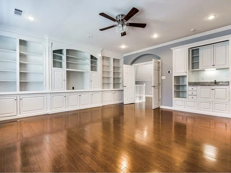 Large upstairs bedroom with built-in shelves