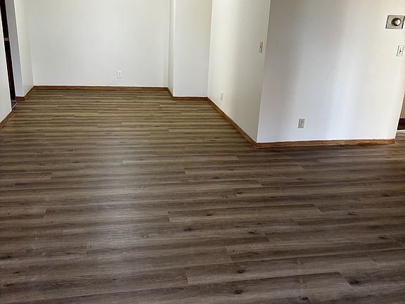 Living room looking into dining room. New Luxury Plank Vinyl