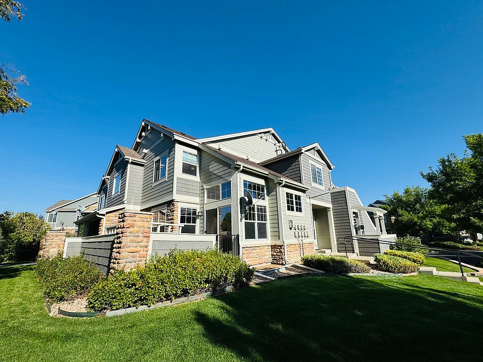 This light filled home is a quiet corner unit surrounded by lawn