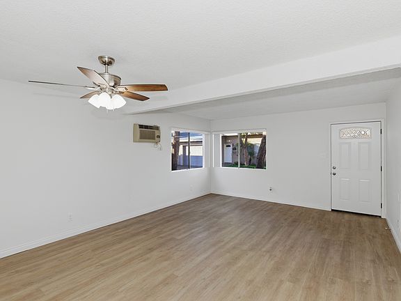 Living Room- Front Entrance, Brand New Ceiling Fan, Flooring & Vertical Blinds
