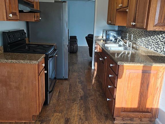 View of the Kitchen taken from dining room. Notice kitchen is a walk through from living room or dining room