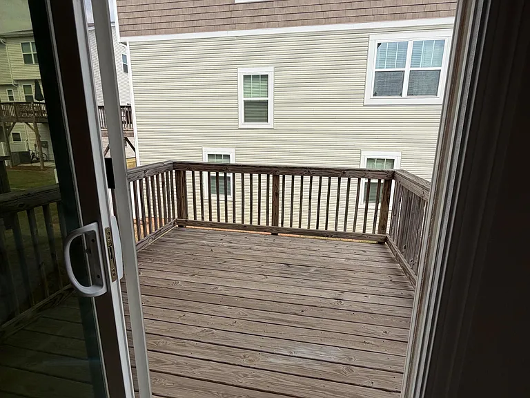 Private wood deck off the home offers an easy spot for fresh air, morning coffee, or light outdoor seating.