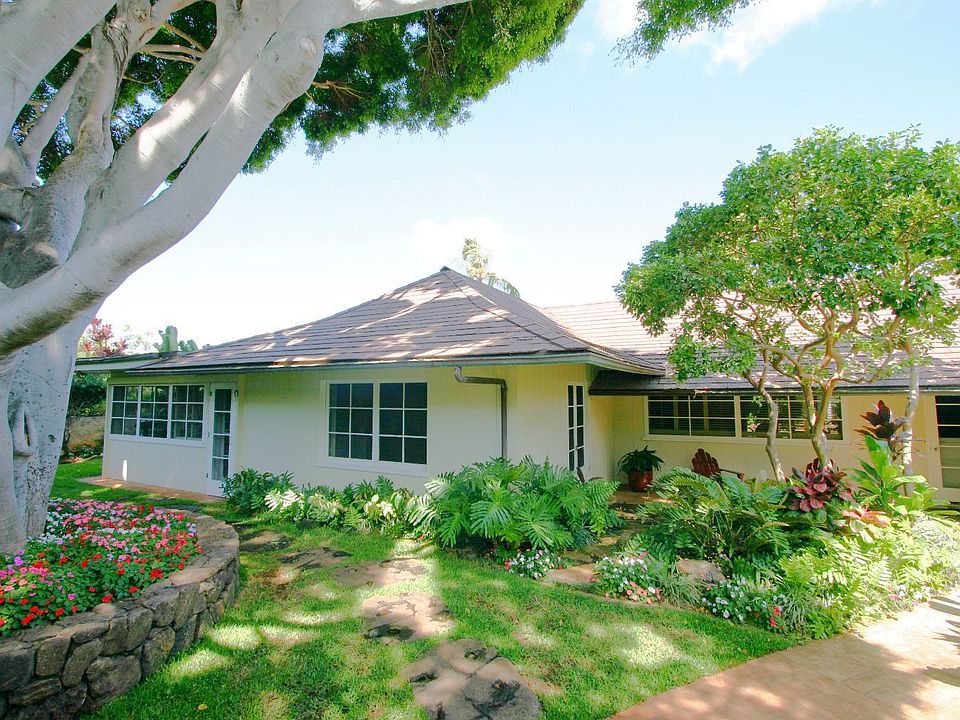 Privately tucked away behind high coral walls