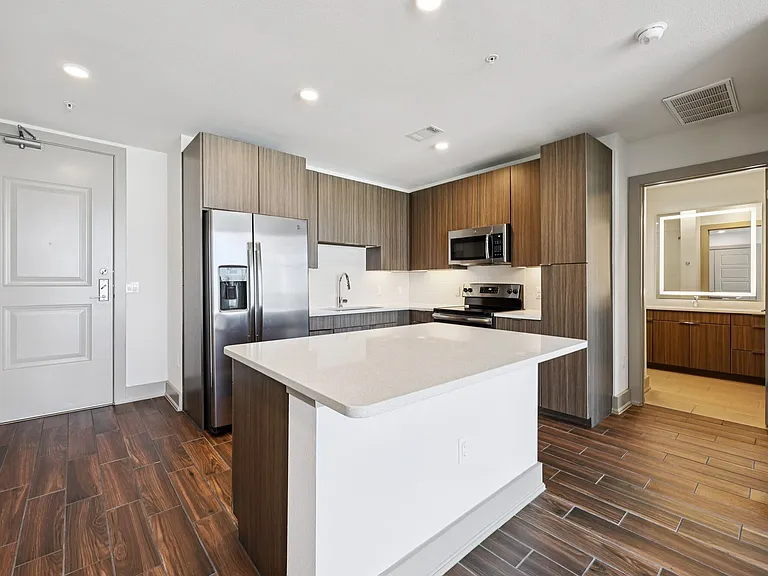 Kitchen with Hardwood floors and brown cabinets