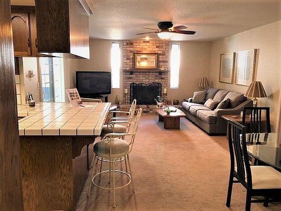 Cozy family room with outdoor patio access. Builtin doggie door too! Gas fireplace.
