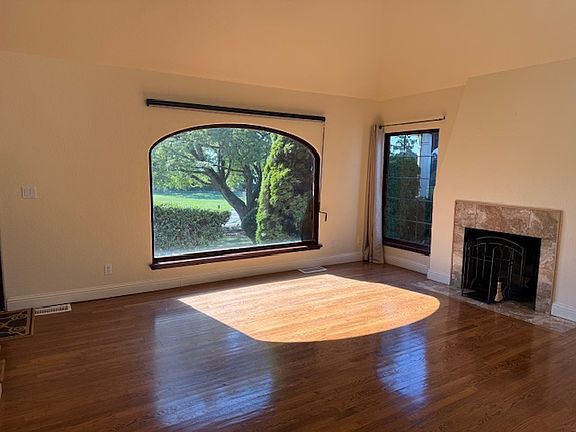 Hardwood floors, window faces park, lake