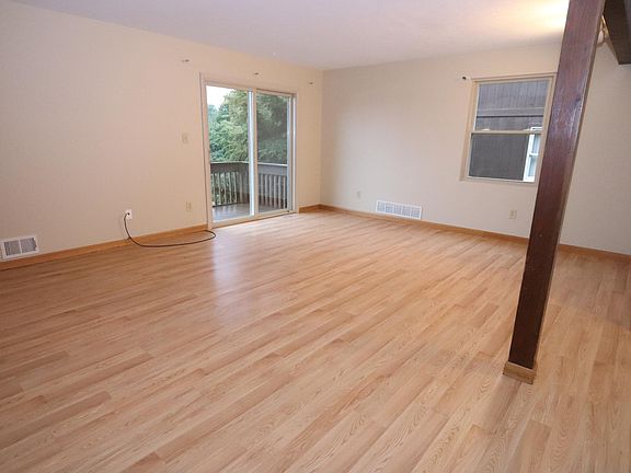 Living Room/Dining area with sliding doors to deck.