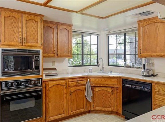The kitchen has a lot of room to move around, with plenty of storage and counter top space.
