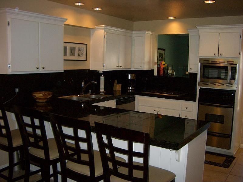 Remodeled Kitchen with Granite Coutner and Stainless Steel Appliances